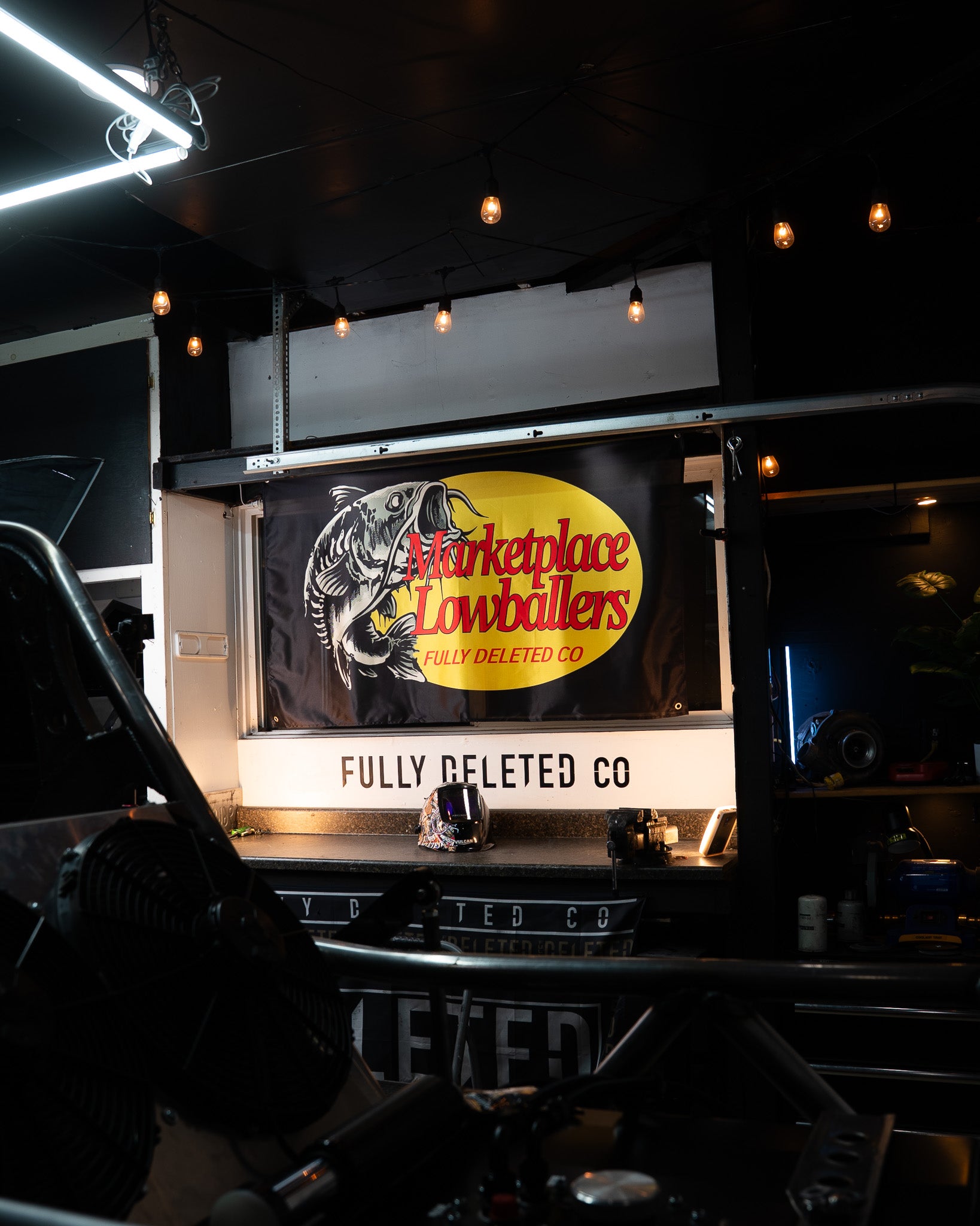 Truck interior with a branded sign for  'Fully Deleted Co'.